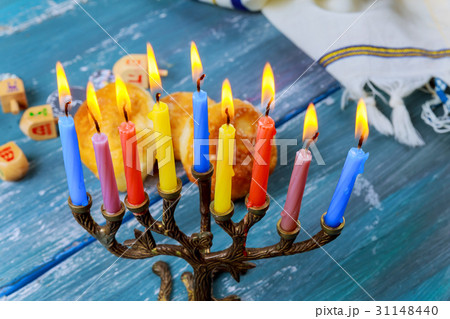 The Jewish menorah with candles, sweet donuts, The Jewish menorah with candles, sweet donuts, 31148440