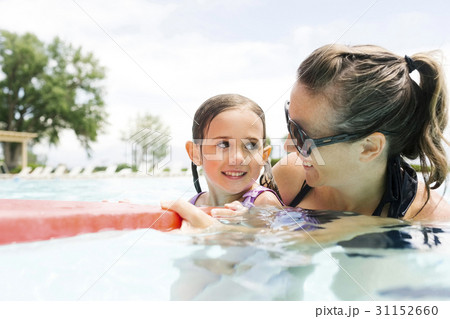 Mother with daughter (4-5) in swimming pool Mother with daughter (4-5) in swimming pool 31152660