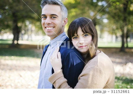Portrait of smiling couple in park Portrait of smiling couple in park 31152661