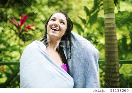 Caribbean Islands, Saint Lucia, Woman with wet hair wrapped in towel with lush foliage in background Caribbean Islands, Saint Lucia, Woman with wet hair wrapped in towel with lush foliage in background 31153060