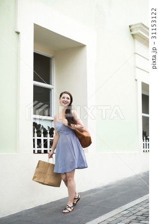 Puerto Rico, San Juan, Happy woman with shopping bag 31153122
