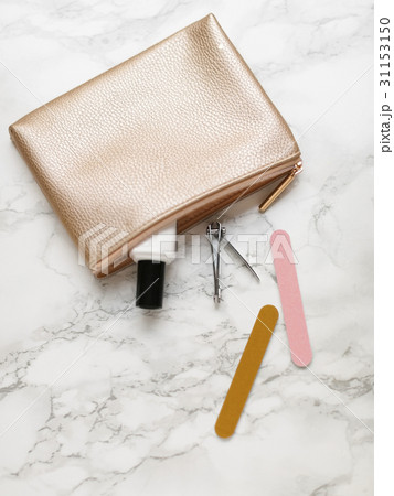 Manicure accessories and purse on marble background Manicure accessories and purse on marble background 31153150