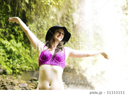 Caribbean, Saint Lucia, Happy woman with arms outstretched Caribbean, Saint Lucia, Happy woman with arms outstretched 31153151