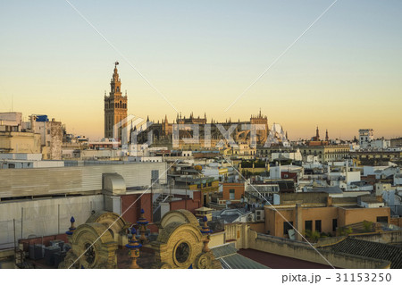 Spain, Seville, Cityscape with Cathedral of Seville at sunset 31153250