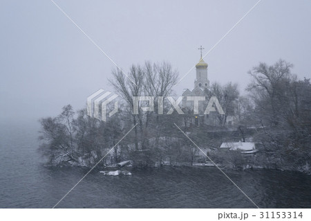 Ukraine, Dnepropetrovsk Region, Dnepropetrovsk city, Church by river at foggy dawn 31153314