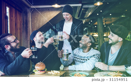 Group of people celebrate party with food and beer Group of people celebrate party with food and beer 31154951