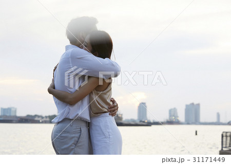 Happy young couple is hugging at the riverside. 31171449