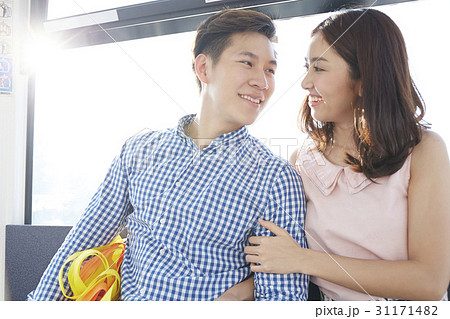 A nice couple with arm in arm is smiling together. A nice couple with arm in arm is smiling together. 31171482