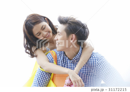 a photo of a woman colling a man and smiling at each other 31172215