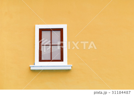 Beautiful vintage window on color wall in urban Beautiful vintage window on color wall in urban 31184487