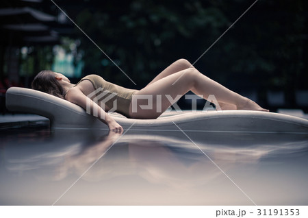 Beautiful lonely girl lies on a lounger Malaysia 31191353
