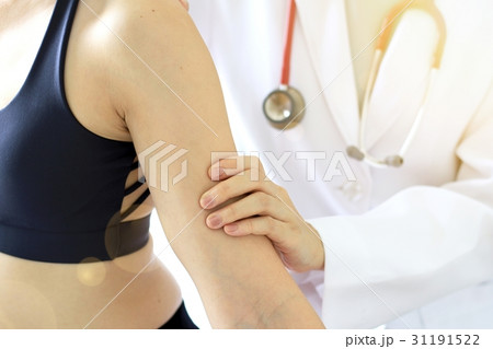 Doctor examining patient, Sport exercise injuries. Doctor examining patient, Sport exercise injuries. 31191522
