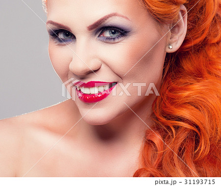 Portrait of beautiful red-haired woman 31193715
