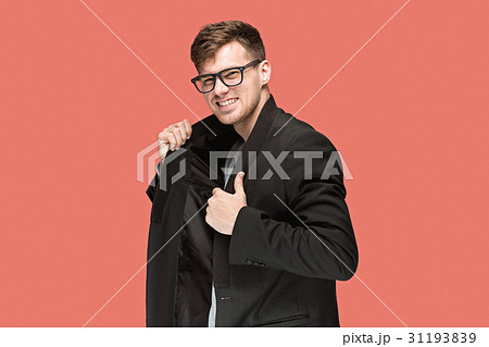 Young handsome man in black suit and glasses Young handsome man in black suit and glasses 31193839
