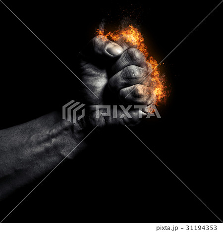 Burning man's clenched fist on a black background Burning man's clenched fist on a black background 31194353