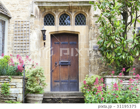 dark brown wooden doors in old house with garden dark brown wooden doors in old house with garden 31195375