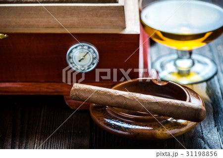 Cigar with glass of cognac and humidor 31198856