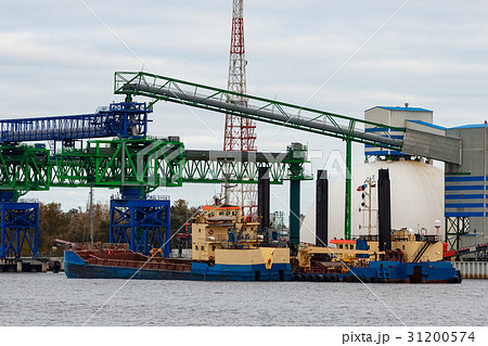 Blue cargo ship loading 31200574