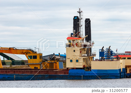 Blue cargo ship loading 31200577