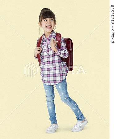 A girl with backpack is smiling A girl with backpack is smiling 31212559