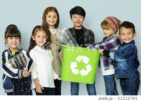 Kids and plastic bottles in a recycle bin 31212765