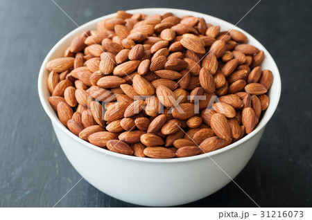 almond nuts in white bowl 31216073