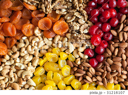 dried fruits and nuts on black background dried fruits and nuts on black background 31216107