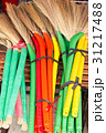 heap of bright brooms on market 31217488