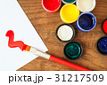 watercolors and brushes on wooden background 31217509