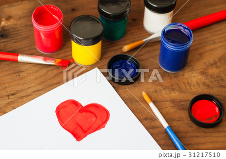 watercolors and brushes on wooden background watercolors and brushes on wooden background 31217510
