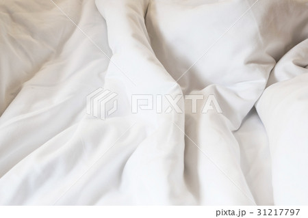 white pillow on bed and with wrinkle messy blanket 31217797