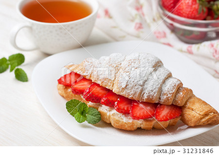 croissant with fresh strawberries, ricotta 31231846