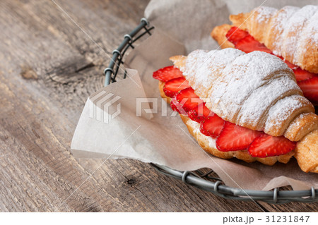 croissant with fresh strawberries, ricotta 31231847