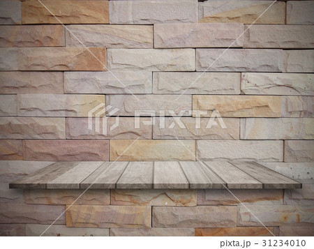 top wooden shelves and stone wall background. top wooden shelves and stone wall background. 31234010