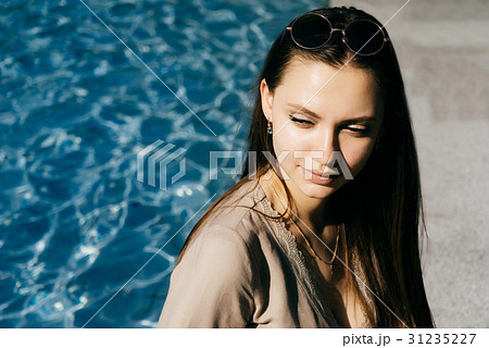Hot woman relax near swimming pool,toned skin 31235227