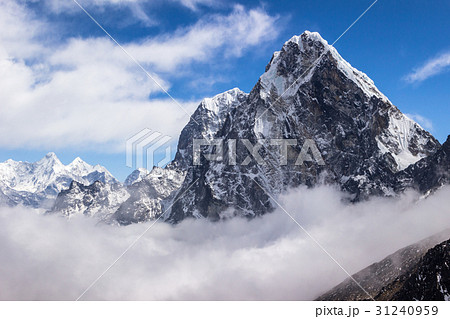 View of Cholatse peak. Blue sky with clouds. 31240959