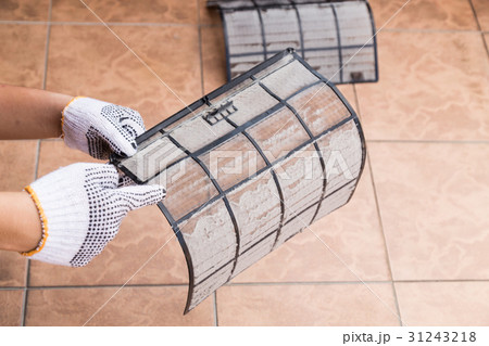 Person point dirty dust on air conditioner filter 31243218