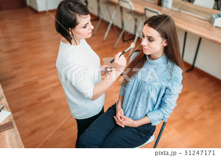 Female make up artist work with woman face 31247171