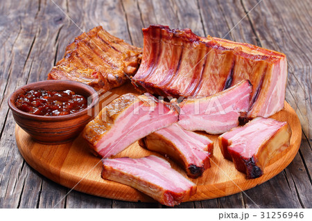 Delicious Smoked Pork Ribs on table Delicious Smoked Pork Ribs on table 31256946