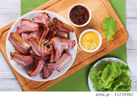 Smoked Pork Ribs on white plate Smoked Pork Ribs on white plate 31256962