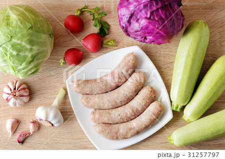 raw meat sausages kupaty and vegetables raw meat sausages kupaty and vegetables 31257797