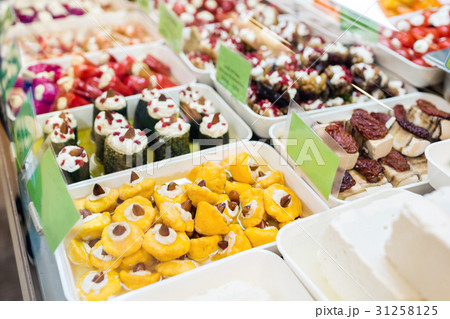 Assorted marinated vegetables and olives on farmer 31258125