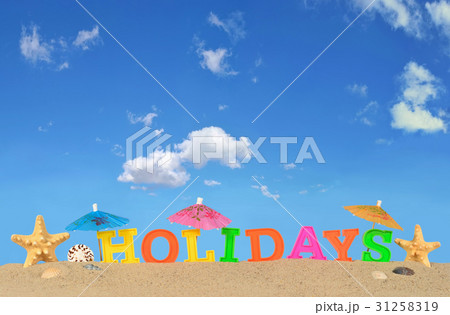 Holidays letters on a beach sand Holidays letters on a beach sand 31258319