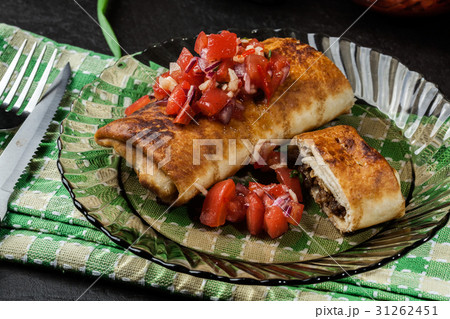 Mexican chimichanga with salasa dip Mexican chimichanga with salasa dip 31262451