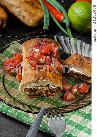 Mexican chimichanga with salasa dip Mexican chimichanga with salasa dip 31262459