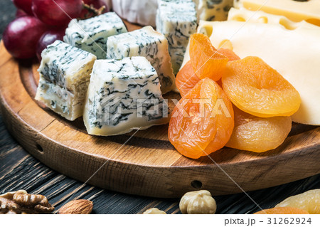 Cheese plate with fruits and nuts Cheese plate with fruits and nuts 31262924