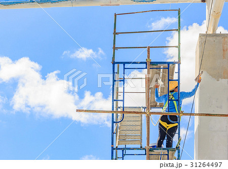 Construction workers working on scaffolding Construction workers working on scaffolding 31264497