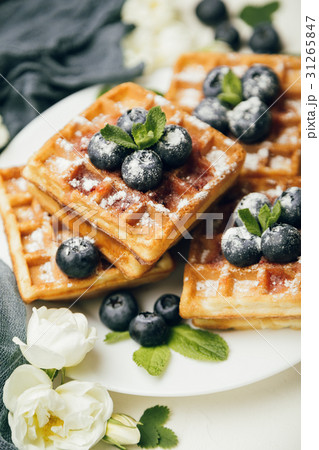 Belgian waffles with fresh berries and mint Belgian waffles with fresh berries and mint 31265847