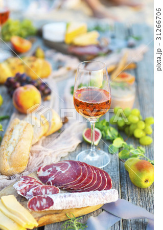 Picnic with rose wine fruits meat and cheese Picnic with rose wine fruits meat and cheese 31266706