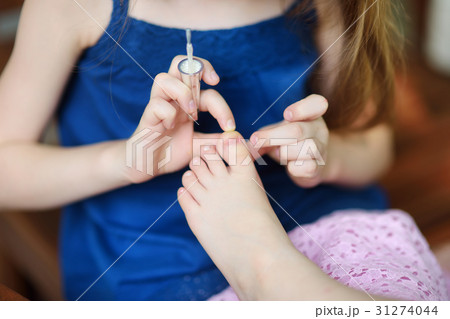 Adorable little girls having fun playing at home Adorable little girls having fun playing at home 31274044